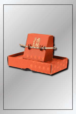 Miniature replica of Kyojuro Rengoku’s Nichirin Sword with flame-themed stand from Demon Slayer