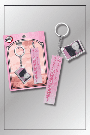 Nezuko Kamado Demon Slayer quote keychain with anime portrait charm and pink text tag in official packaging
