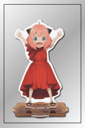 Anya Forger acrylic figurine from Spy x Family in a red dress with arms raised in excitement.