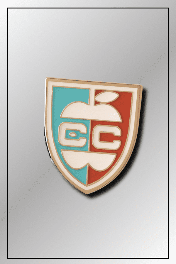 Close-up of SPY x FAMILY Eden College crest badge with EC apple design