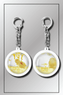 SPY x FAMILY dome keychain showing yellow back side with series logo