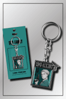 Packaged SPY x FAMILY Loid Forger keychain in card-style frame with teal backing