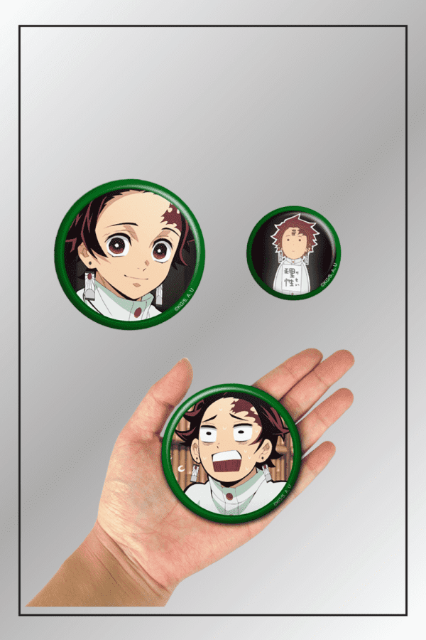 3-piece Demon Slayer badge pin set with Tanjiro Kamado expressions including one pin held in hand for size comparison