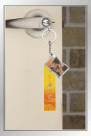 Zenitsu Agatsuma Demon Slayer quote keychain with portrait charm and orange tag hanging on door handle